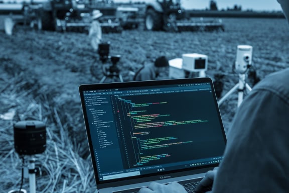 Person walking on a computer in a field