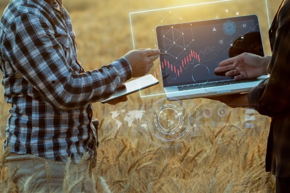 Farmer using digital tablet computer